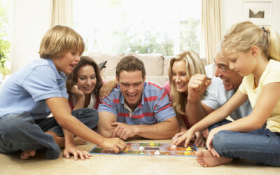 Family Playing Board Game At Home